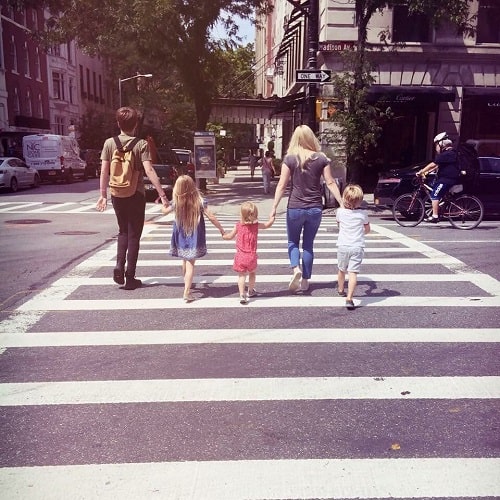 A picture of Olive with her siblings and mamma, Georgia crossing the road.